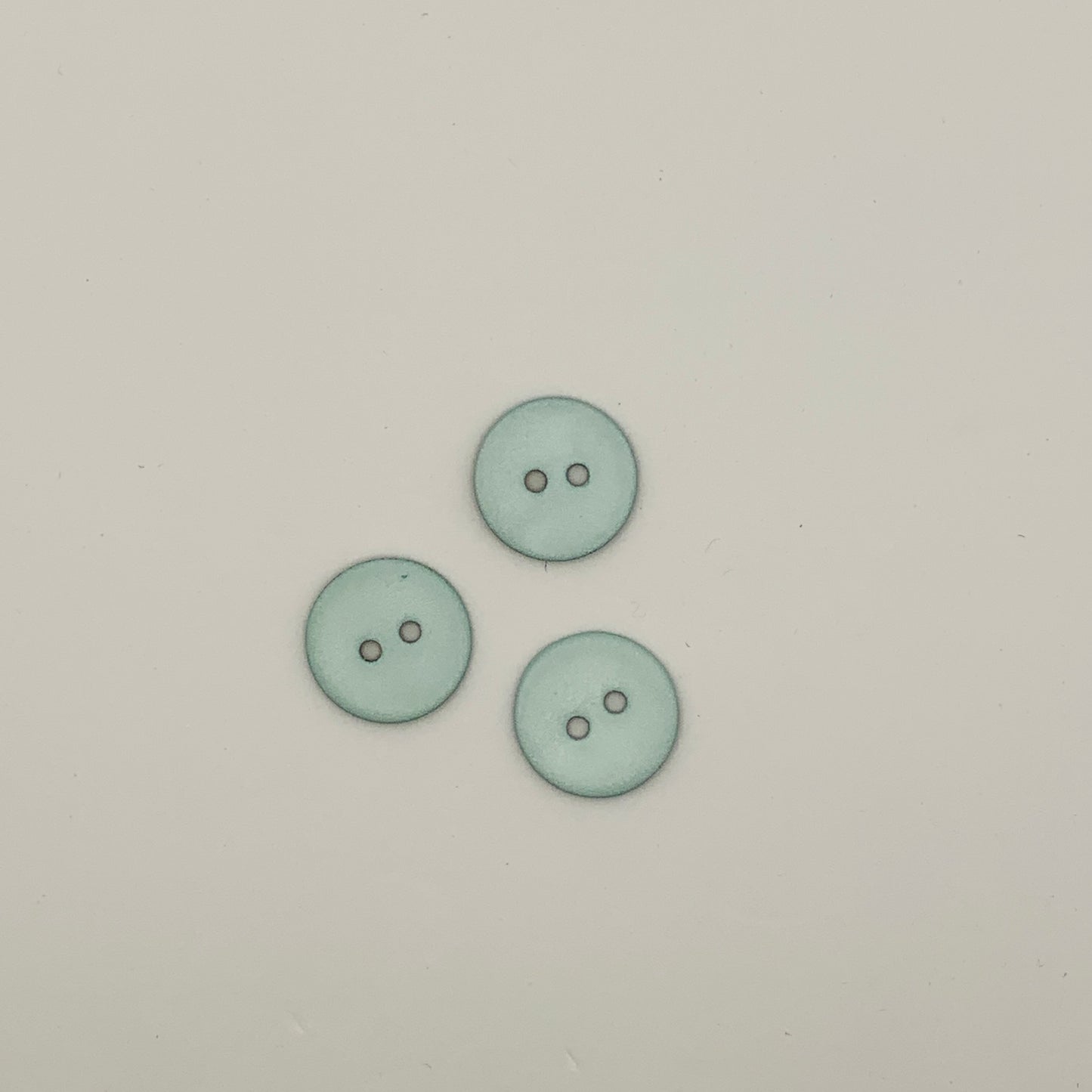 Boutons en nacre coloré