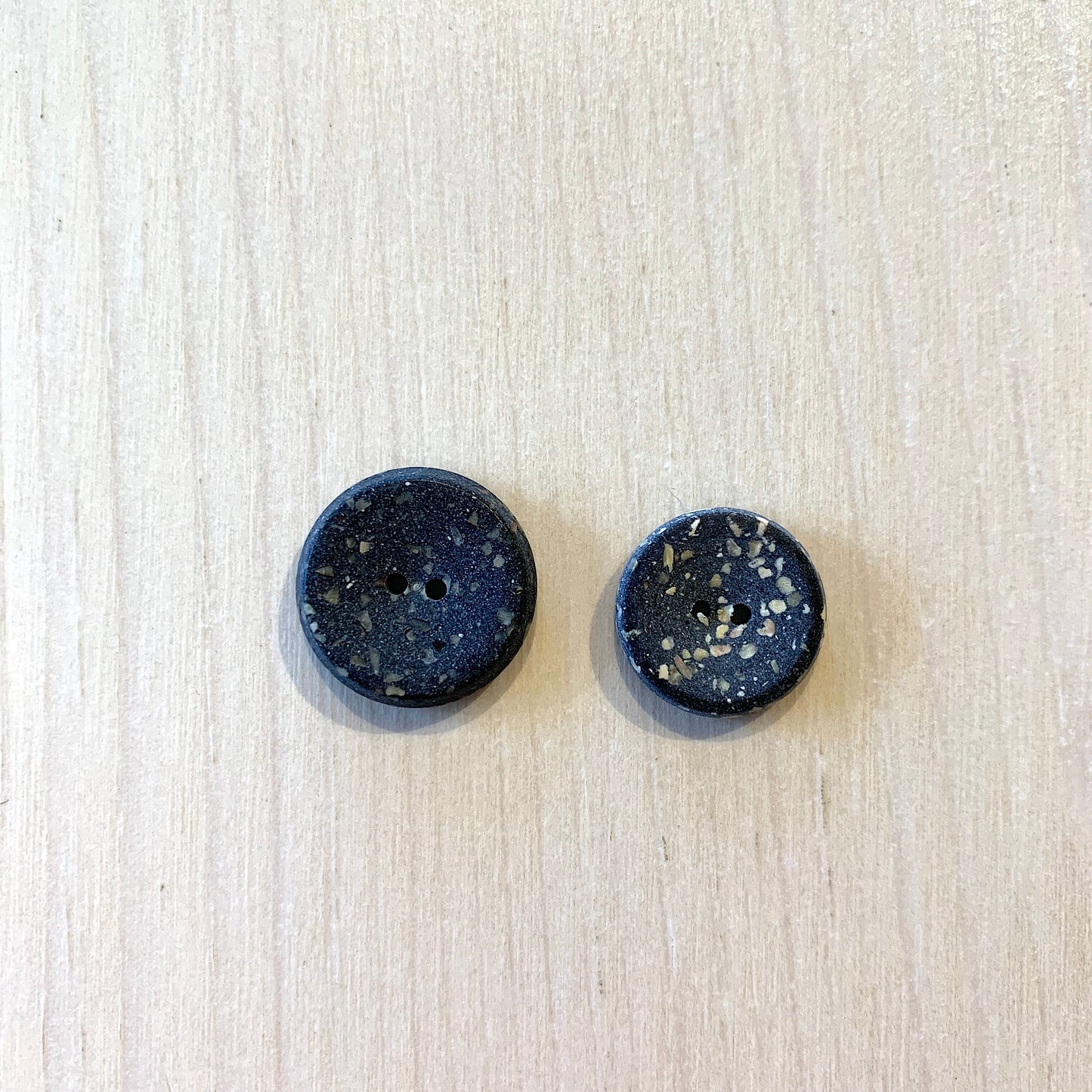 Recycled polyester buttons